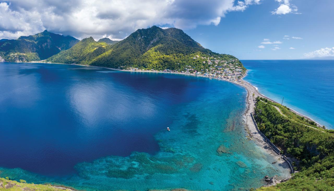 Aerial view of Roseau and its deep blue bay